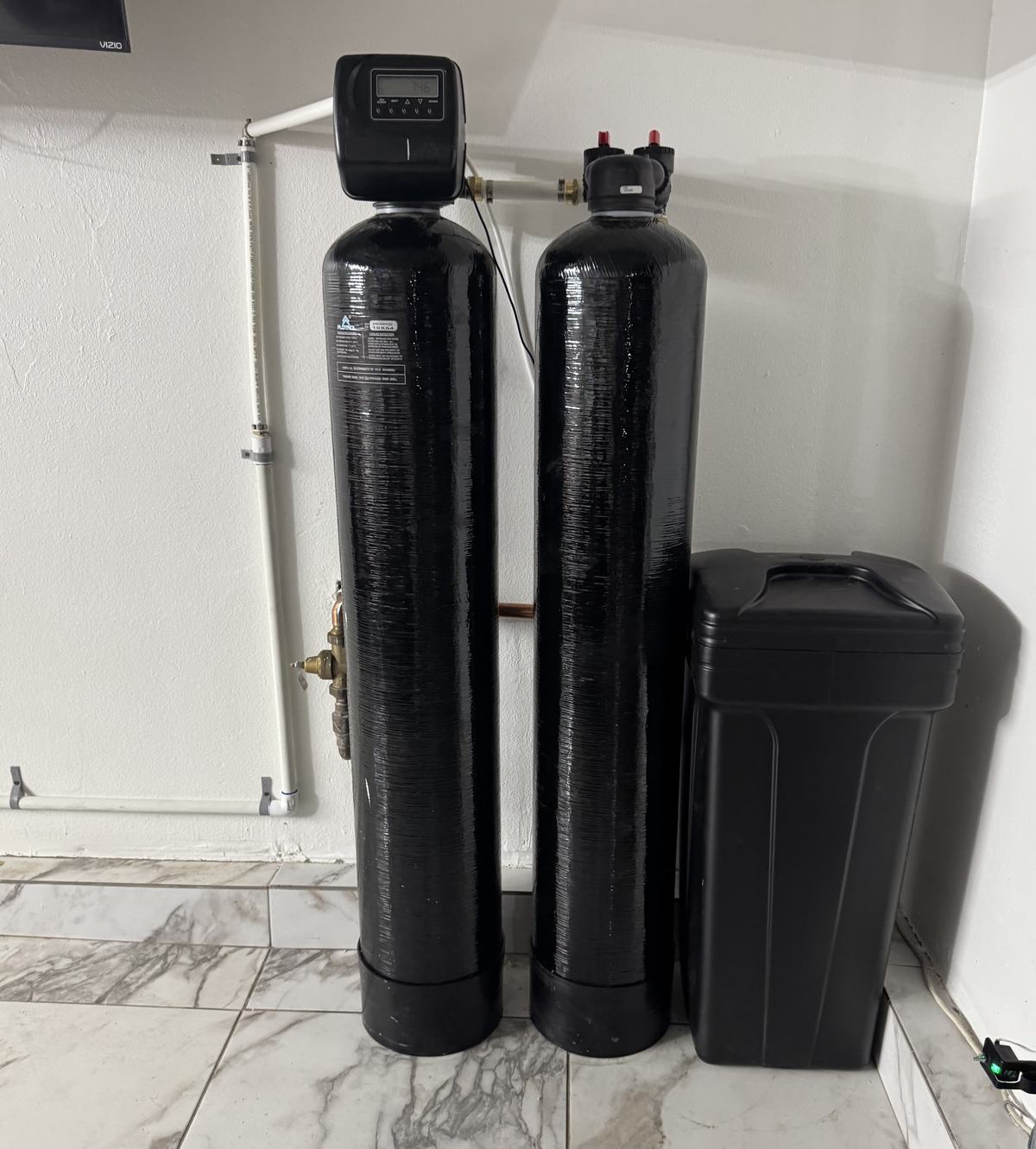 Whole-home water softener and filtration system installed in a San Diego garage